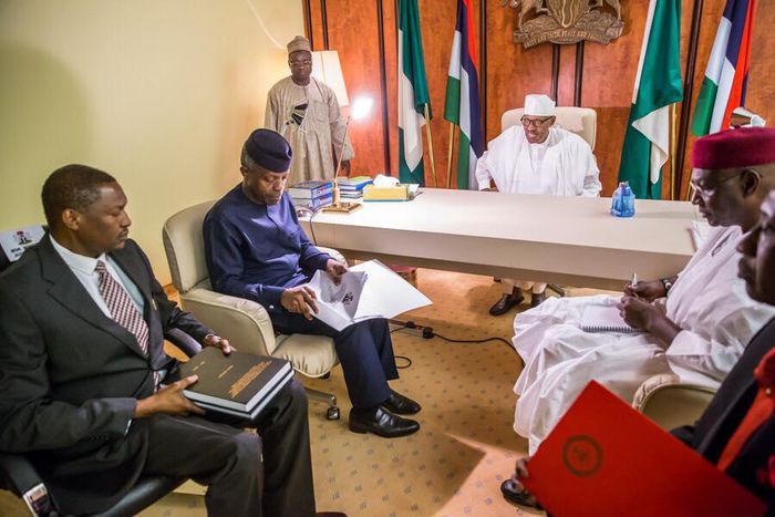 Members of the Presidential Investigation Panel presenting the report of their investigation to President Muhammadu Buhari in Abuja