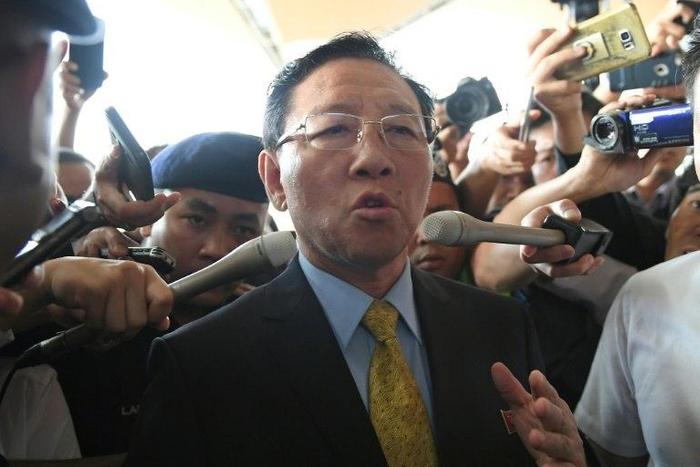Pyongyang has responded to the expulsion of its ambassador Kang Chol (C) from Kuala Lumpur by banning all Malaysian citizens from leaving North Korea