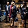 French presidential election candidate for the far-right Front National (FN) party Marine Le Pen (C) arrives at political rally to kick off her campaign next to her aide Catherine Griset (R) and bodyguard Thierry Legier (L) February 4, 2017
