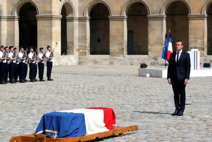 French President Emmanuel Macron pays his respects to the flag-draped coffin of Holocaust survivor Simone Veil, during a tribute ceremony at the Invalides in Paris, on July 5, 2017