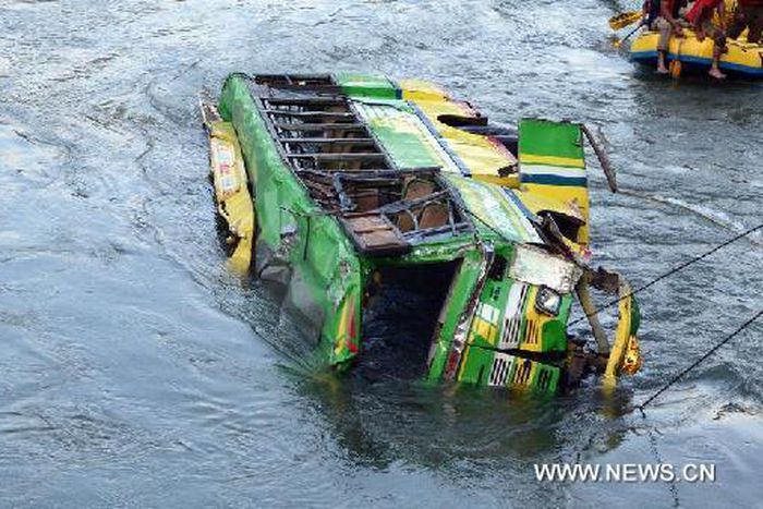 Police say 44 die as bus falls into river