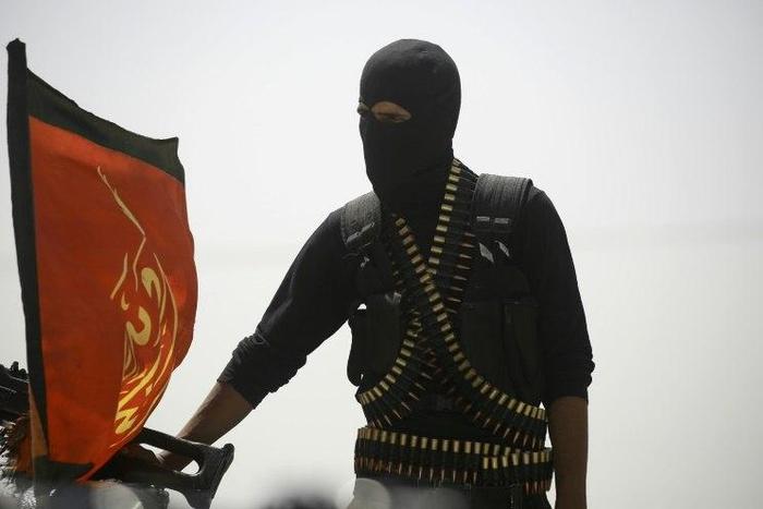 A member of the US-backed Syrian Democratic Forces (SDF) pictured in the village of Hazima on the northern outskirts of the Islamic State group's bastion of Raqa on June 6, 2017