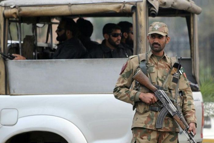 A Pakistani army soldier stands guard at a checkpoint in the garrison city of Rawalpindi on December 5, 2009