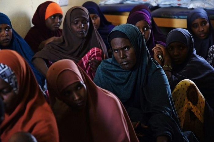 A group of Kenyan women listen during a course at the local maternity facility on what Islam allows and does not allow in terms of family planning, and on the benefits of family planning at a village in north-eastern Wajir County