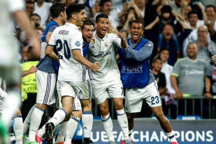 Real Madrid's forward Cristiano Ronaldo (2R) celebrates a goal during the UEFA Champions League quarter-final second leg football match Real Madrid vs FC Bayern Munich at the Santiago Bernabeu stadium in Madrid in Madrid on April 18, 2017