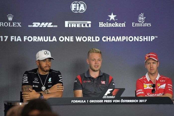 (From L) Mercedes' British driver Lewis Hamilton, Haas F1's Danish driver Kevin Magnussen and Ferrari's German driver Sebastian Vettel attend a driver's press conference ahead of the Austrian Formula One Grand Prix in Spielberg on July 6, 2017.