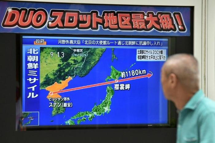 Asian markets tumbled and the yen rallied after North Korea stoked geopolitical tensions by firing a ballistic missile over Japan, a move Japanese Prime Minister Shinzo Abe warned 'greatly damages regional peace and security'