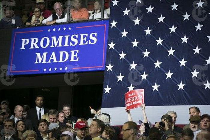 An audience member holds up a Make America Great Again sign in a crowd waiting to hear President Donald Trump speak at a campaign-style rally at the Kentucky Exposition Center in Louisville, March 20, 2017. Trump delivered a rollicking populist and nat...