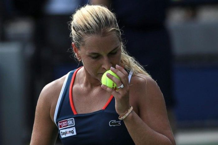 Dominika Cibulkova of Slovakia smells a ball as she plays against to Lesia Tsurenko of Ukraine during their 2016 US Open Women's Singles match at the USTA Billie Jean King National Tennis Center in New York on September 2, 2016