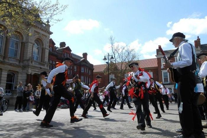 Morris dancers perform in the main square of the market town of Retford, Nottinghamshire on April 23, 2017