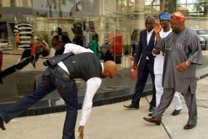Banky W prostrating for Dele Momodu