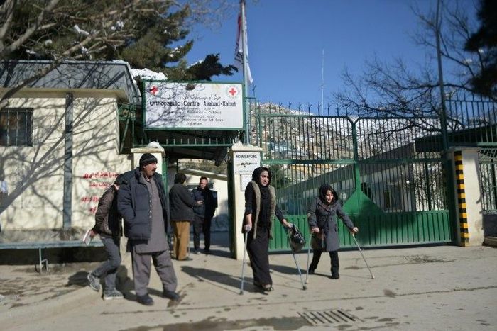 The flag of the International Committee of the Red Cross flies at half-mast at the entrance to the ICRC Orthopaedic Centre in Kabul on February 9, 2017