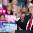 US President Donald Trump (C) speaks during a rally in Harrisburg, Pennsylvania marking his 100th day in office
