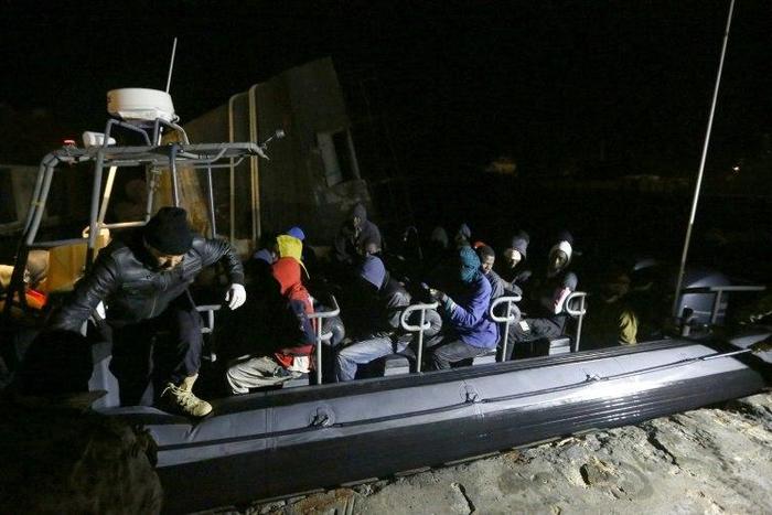 Libyan coastguards help migrants who were rescued at sea off the coast of Tripoli, on February 5, 2017