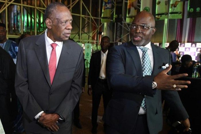 President of the Nigerian Football Federation Amaju Pinnick (R) speaks with incumbent president of the Confederation of African Football Issa Hayatou in January 2017