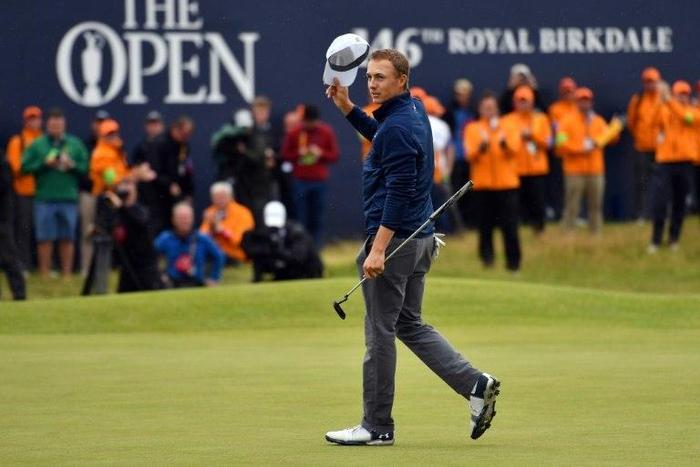 US golfer Jordan Spieth celebrates on the 18th green of the Royal Birkdale golf course on July 23, 2017
