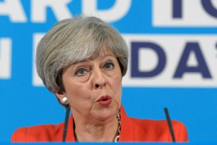 Britain's Prime Minister Theresa May was accused of backpedaling on a key campaign pledge