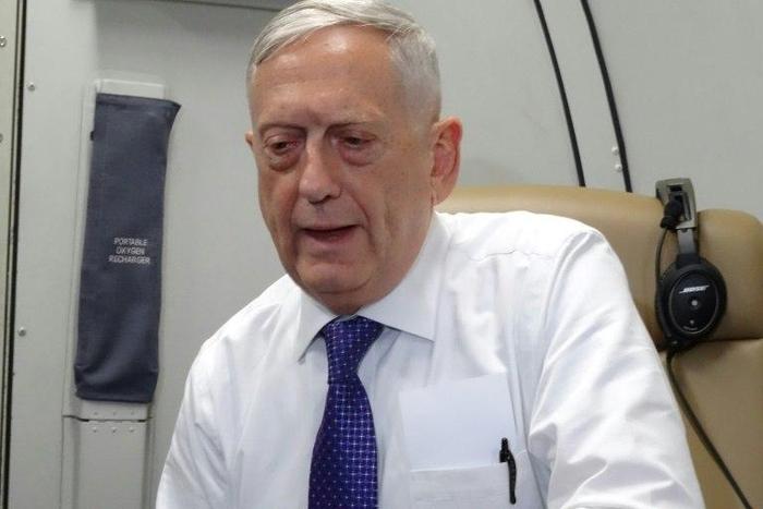 US Defense Secretary James Mattis speaks to reporters on board a flight to Jordan for the start of a regional tour on August 20, 2017