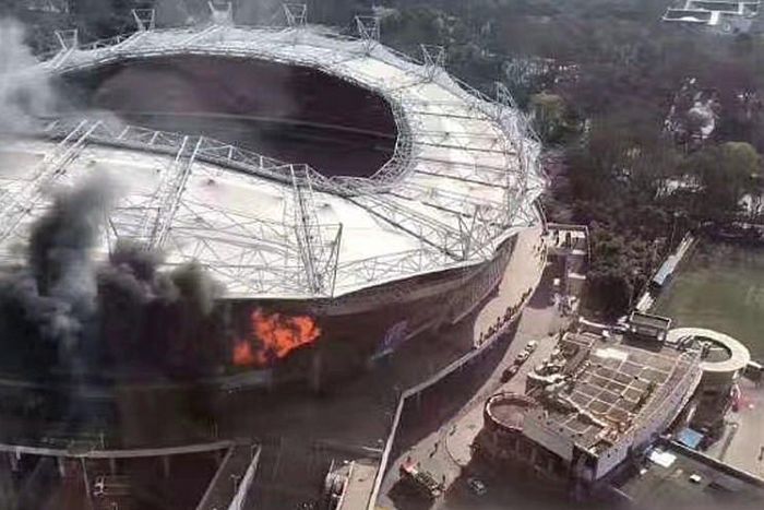 The fire broke out in one corner of the 33,000-capacity stadium, causing considerable damage inside and outside