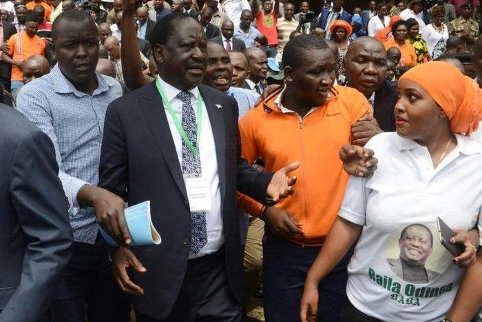 Kenya's National Super Alliance (NASA) and opposition leader Raila Odinga (C) arrives to present his candidacy for the presidential race at the Independent Electoral and Boundaries Commission in Nairobi, on May 28, 2017