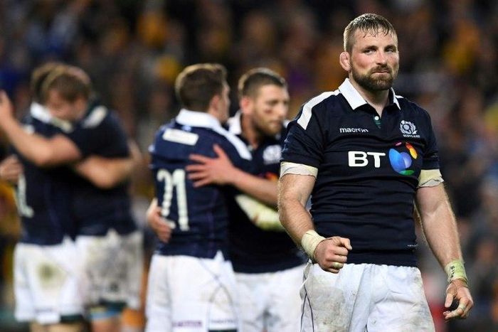 Scotland's captain John Barclay (R) celebrates after beating Australia in their rugby union Test match in Sydney, on June 17, 2017
