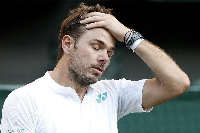 Switzerland's Stan Wawrinka reacts during his men's singles first round match, which he lost to Daniil Medvedev, on the first day of the 2017 Wimbledon Championships at The All England Lawn Tennis Club in Wimbledon, southwest London