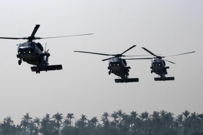 Taiwanese military helicopters fly in formation during a drill in Kaohsiung in January 2017