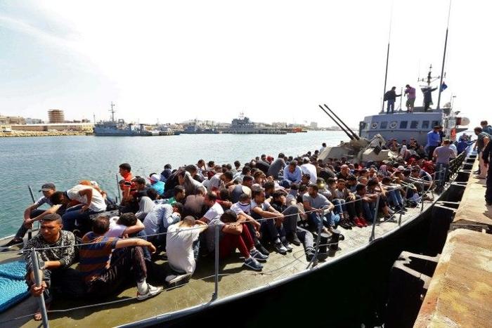 Migrants whose boat was intercepted by the Libyan coastguard in the Mediterranean arrive at a naval base in the capital Tripoli on May 10, 2017