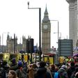 Members of the emergency services work on Westminster Bridge, alongside the Houses of Parliament in central London on March 22, 2017
