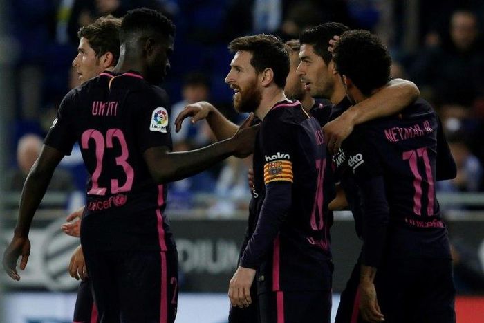 Barcelona's Luis Suarez (2ndR) celebrates with teammates after scoring his team's third goal during their Spanish league football match against Espanyol on April 29, 2017