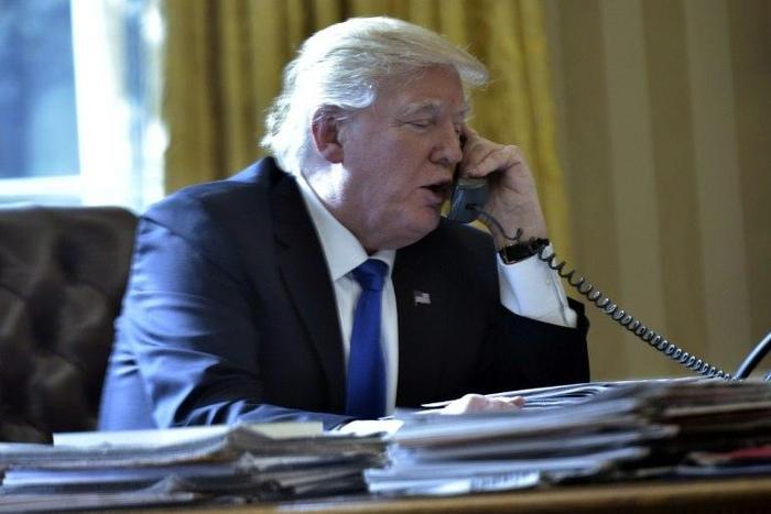 US President Donald Trump speaks on the phone with Russia's President Vladimir Putin from the White House on January 28, 2017