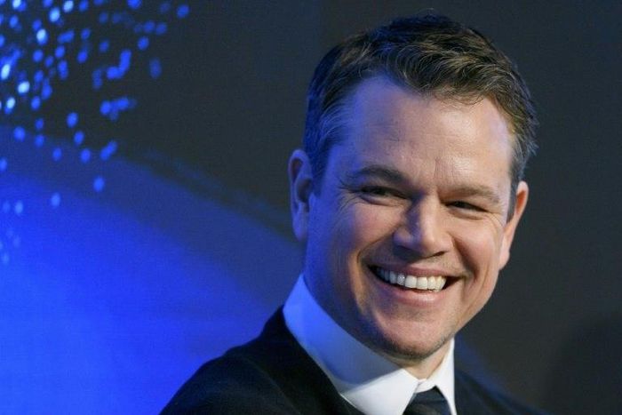 US actor Matt Damon smiles as he takes part in a meeting on the opening day of the World Economic Forum, on January 17, 2017 in Davos