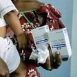 An HIV-positive woman collects her anti-retroviral drugs in Lagos, Nigeria.