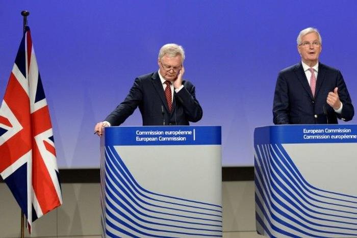 EU Brexit negotiator Michel Barnier (R) says after talks with his British counterpart David Davis that the two sides remain at odds on Britain's divorce bill and over the rights of European citizens living in Britain
