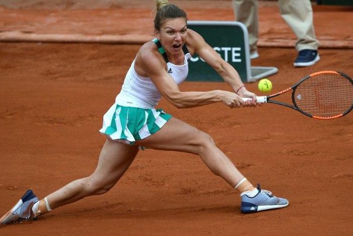 Romania's Simona Halep returns the ball to Czech Republic's Karolina Pliskova during their French Open semi-final match, at the Roland Garros in Paris, on June 8, 2017