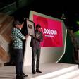 Comedian Mark Angel receiving the gold-plated YouTube plaque at Google For Nigeria for hitting 1 million YouTube subscribers, the first Nigerian-owned channel to do so.