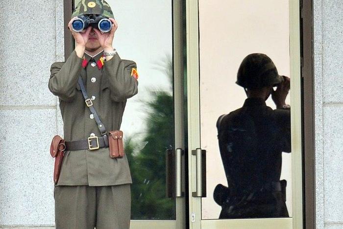 A North Korean soldier looks at the South side at the truce village of Panmunjom in the Demilitarized zone (DMZ) dividing the two Koreas on July 27, 2013