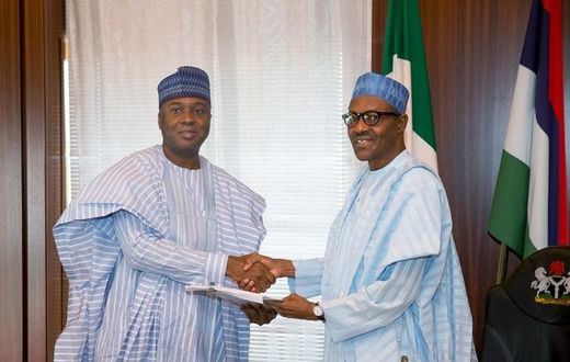 Nigeria's President Muhammadu Buhari (R) receive a letter of confirmation from the President of the Senate of Nigeria Bukola Saraki in Abuja, Nigeria, November 3, 2015. REUTERS/Stringer