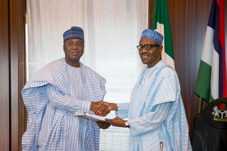 Nigeria's President Muhammadu Buhari (R) receive a letter of confirmation from the President of the Senate of Nigeria Bukola Saraki in Abuja, Nigeria, November 3, 2015. REUTERS/Stringer