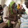 An health official measures the arm circumference of a child to control malnutrition at UNICEF Clinic near a camp for Internal displaced people (IDP) Camps in Dikwa, Nigeria February 14, 2017