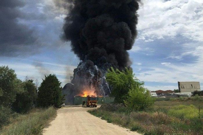 Black smoke billows after an explosion at a warehouse containing hazardous chemical waste near Madrid on May 4, 2017