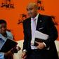 Abrahams walks past his deputy Adv Nomgcobo Jiba as he leaves at the end of a media briefing in Pretoria