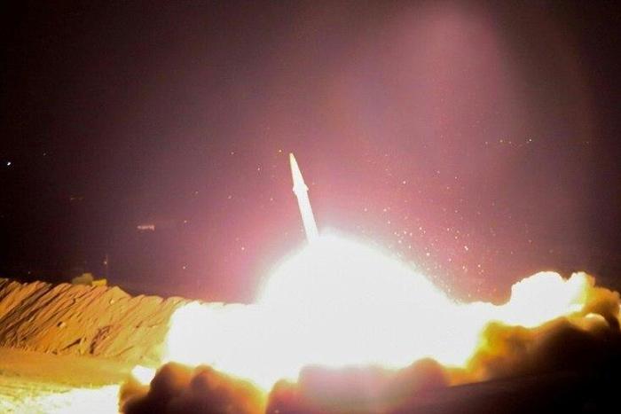 A handout picture provided by Iran's state TV IRIB and released on June 18, 2017 shows Iran's Revolutionary Guards launching a missile from an undisclosed location in western Iran, towards Islamic State group bases in Syria