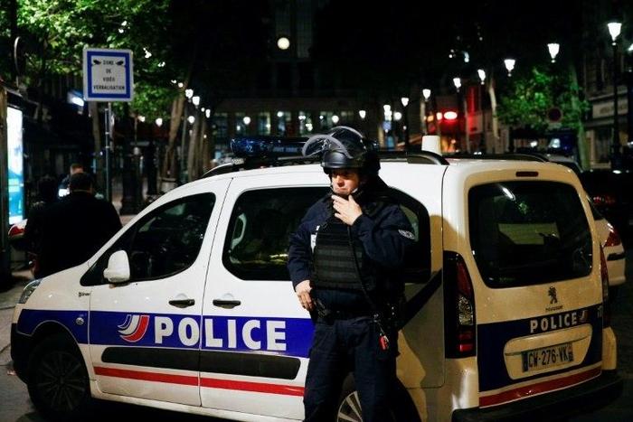 A French Police officer stands guard in front of the North station in Paris, on late May 8, 2017, during a police operation following an evacuation due to a security alert