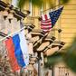A Russian flag flies next to the US embassy building in Moscow