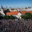 Demonstrators hold up flags of Slovakia and EU during an anti-corruption rally in Bratislava on June 5, 2017