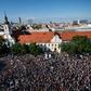 Demonstrators hold up flags of Slovakia and EU during an anti-corruption rally in Bratislava on June 5, 2017