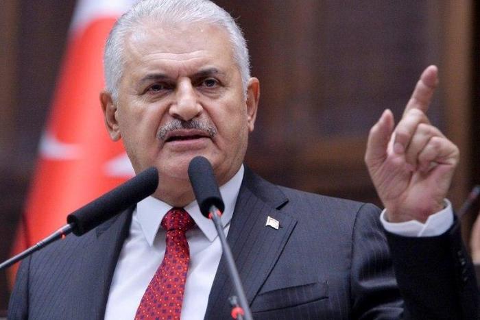 Turkish Prime Minister Binali Yildirim delivers a speech during the AK Party's group meeting at the Grand National Assembly of Turkey (TBMM) in Ankara, on May 16, 2017