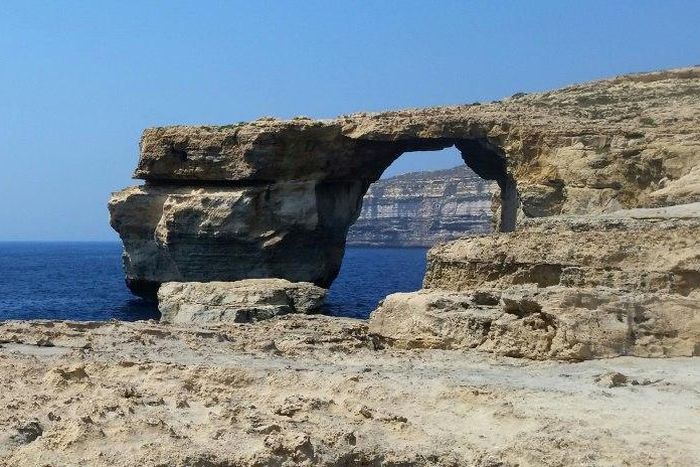 A picture taken on July 21, 2015 in Malta shows the Azure Window, a limestone arch on Gozo island