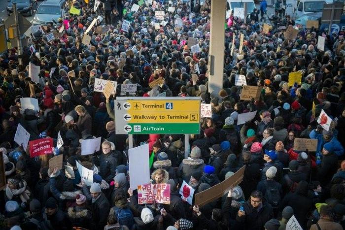 Demonstrators at JFK International Airport protest President Donald Trump's executive order suspending refugee arrivals and imposing tough controls on some travellers
